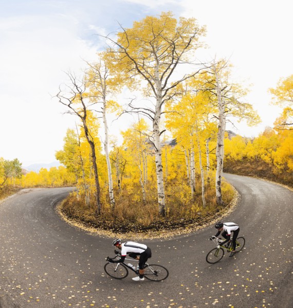 Caucasian cyclists on rural road