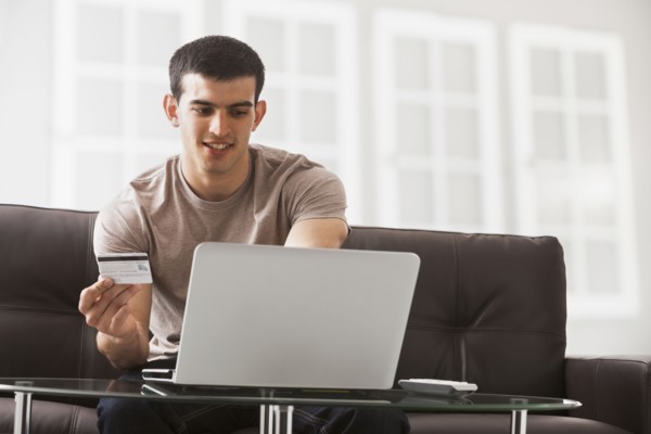 Hispanic man shopping online