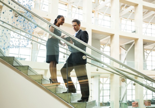 Business people talking on staircase