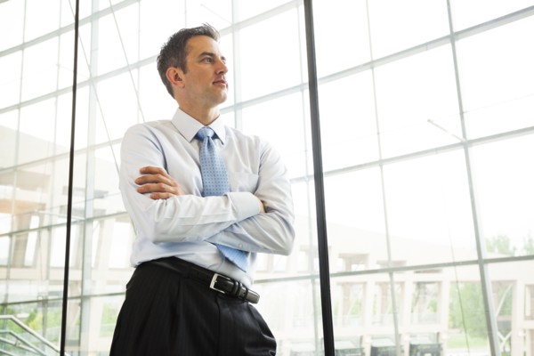 Caucasian businessman standing at window