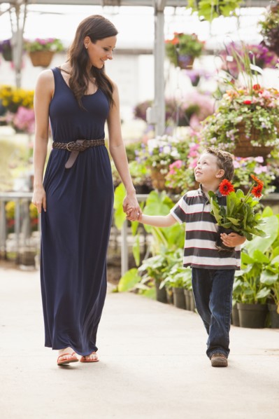 Caucasian mother and son shopping in nursery