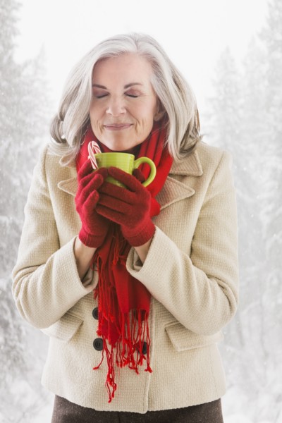 Caucasian woman drinking hot chocolate outdoors