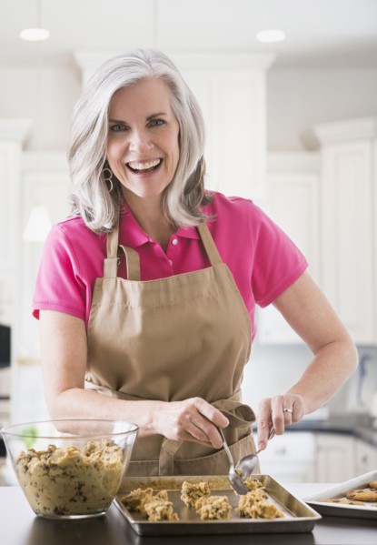 Portrait of Caucasian woman baking cookies