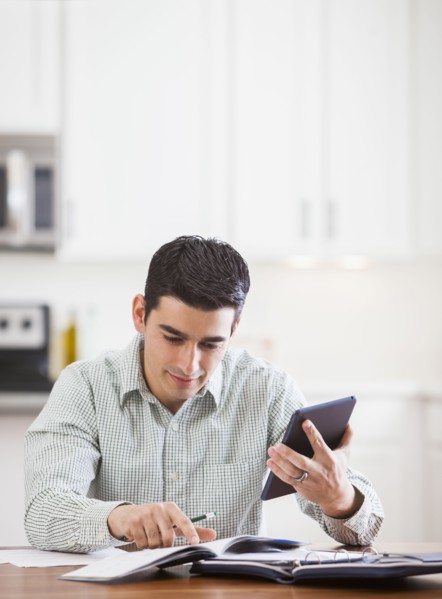 Hispanic businessman working at home