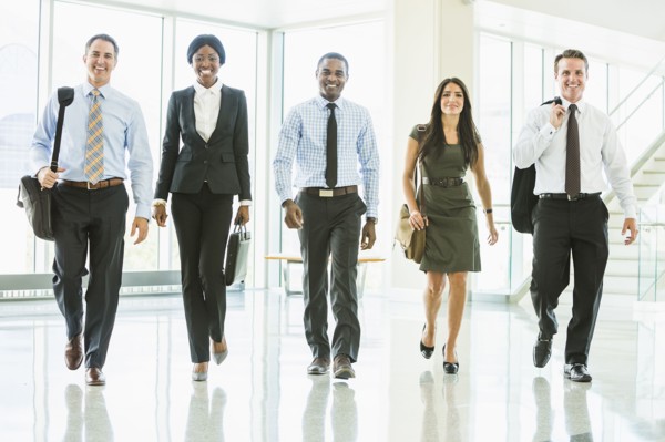 Business people walking in office lobby