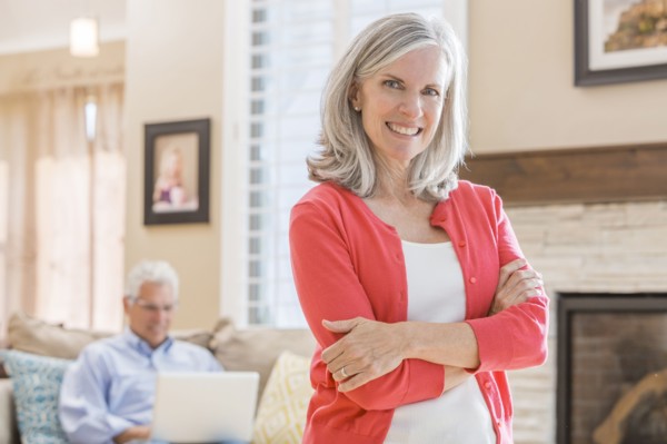 Caucasian woman standing in living room