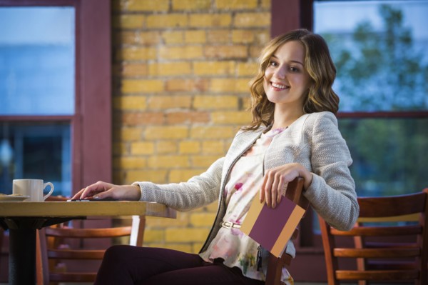 Caucasian woman holding menu in restaurant
