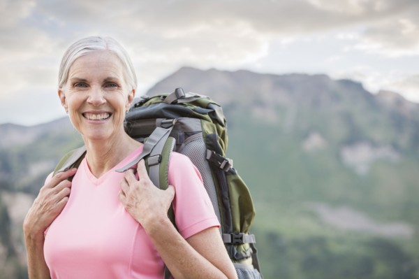 Caucasian woman hiking on mountain