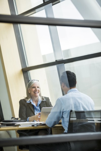 Business people smiling in meeting