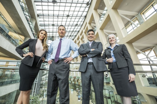 Portrait of smiling business people in lobby
