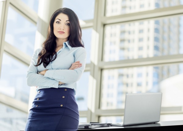 Caucasian businesswoman posing in office