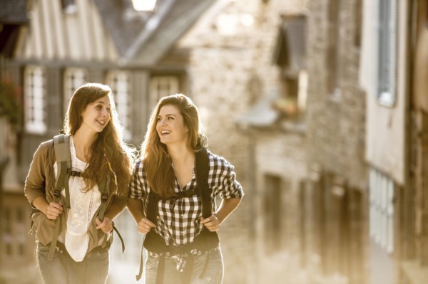 Caucasian women backpacking in city