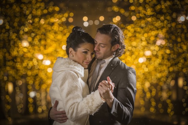 Caucasian couple dancing at night