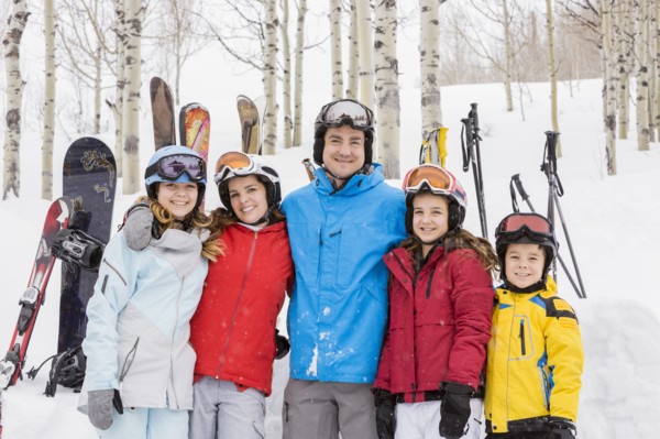 Portrait of smiling Caucasian family on skiing vacation