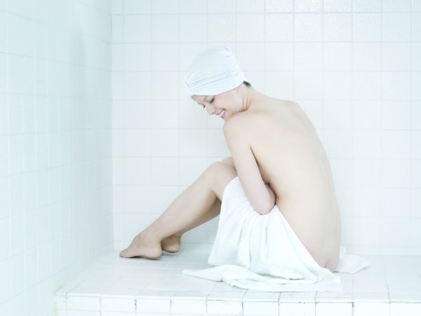Caucasian woman wrapped in a towel