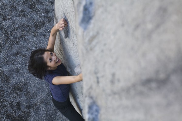 Filipino woman rock climbing