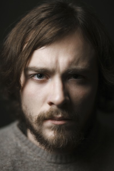 Close up of serious Caucasian man with beard