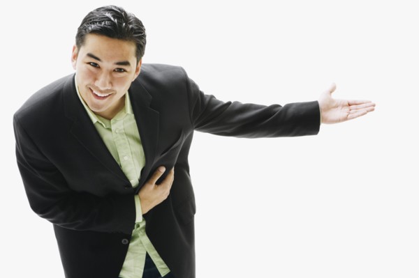 Asian man bowing with arm out