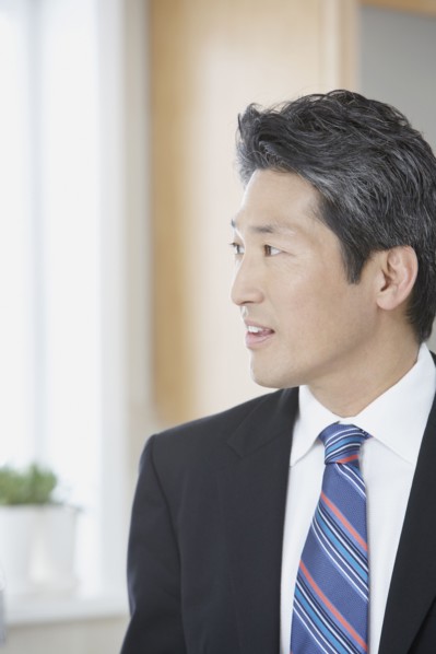 Asian businessman looking to side