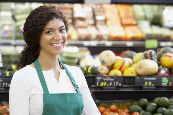 Mixed Race clerk in grocery store
