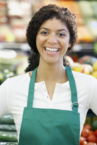 Mixed Race clerk in grocery store