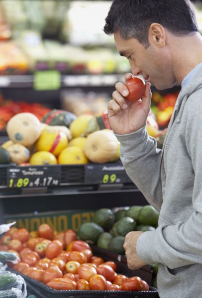 Hispanic man shopping for produce