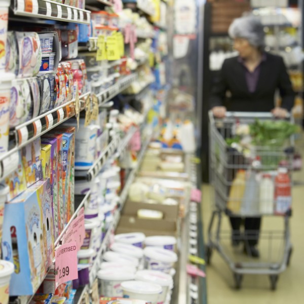 Senior Asian woman shopping in grocery store