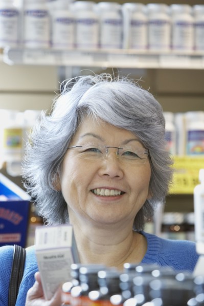 Senior Asian woman shopping for vitamins