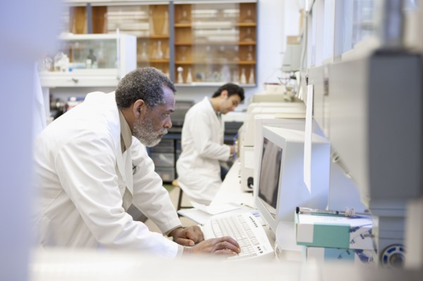 African American scientist working in laboratory