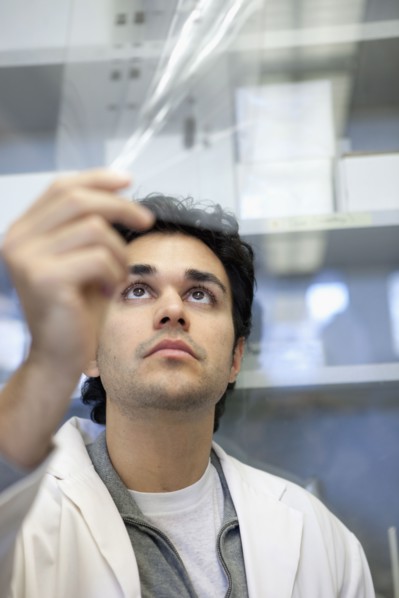 Middle Eastern scientist working in laboratory