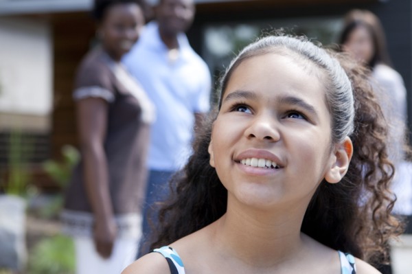 Smiling mixed race girl looking up
