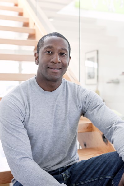 Black man sitting on stairs