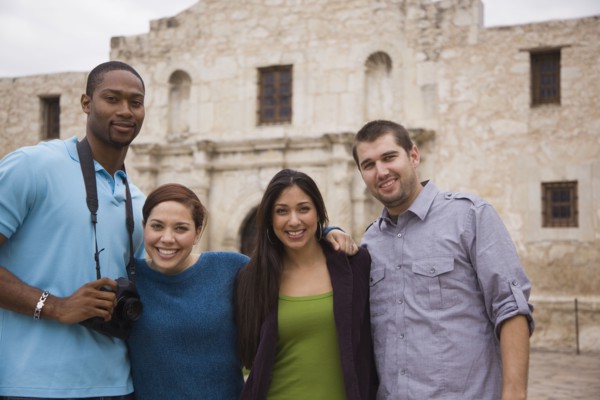 Smiling couples at tourist attraction