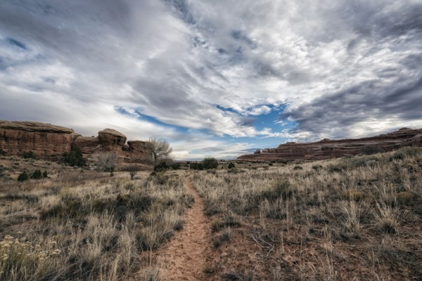 Clouds over desert path