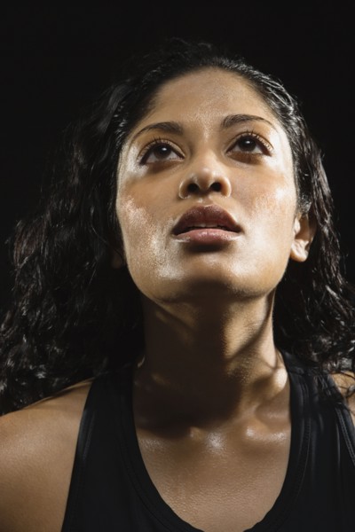 Sweaty Indian woman in athletic gear