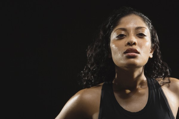 Sweaty Indian woman wearing tank top