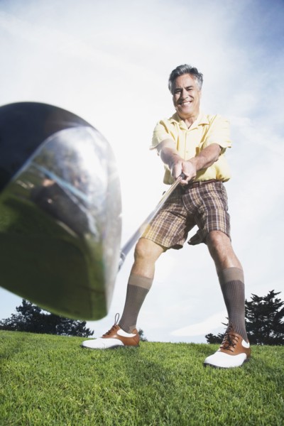 Man swinging golf club