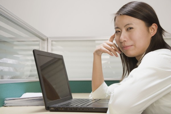 Chinese businesswoman using laptop at desk