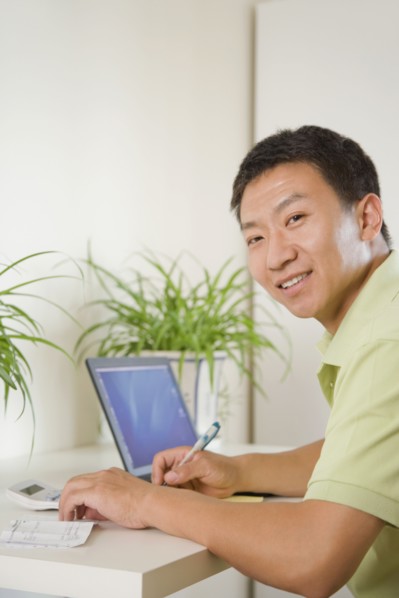 Chinese man using laptop
