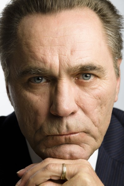 Serious Caucasian businessman with hands on chin