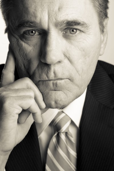 Serious Caucasian businessman with head in hands