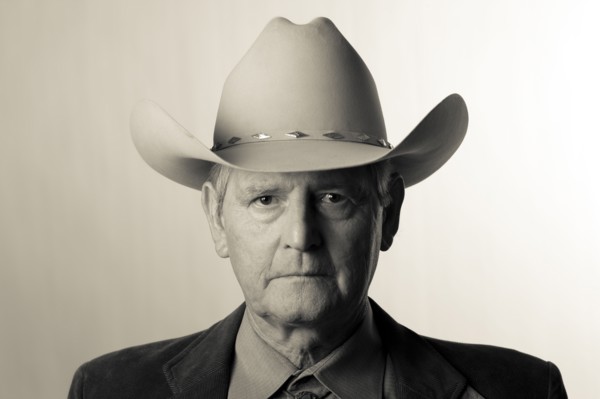 Serious man wearing cowboy hat