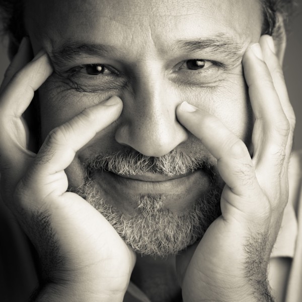 Middle Eastern man with head in hands