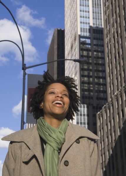 African American woman laughing in urban scene