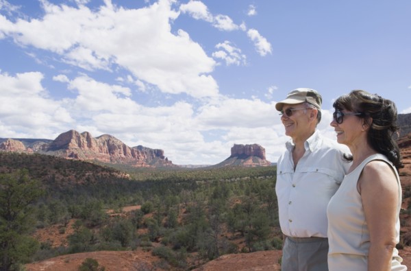 Multi-ethnic senior couple looking at desert landscape