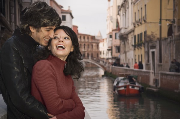 Italian couple hugging near canal