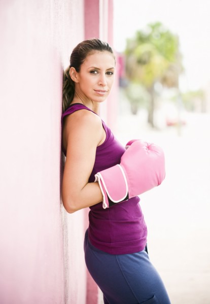 Hispanic woman in boxing gloves