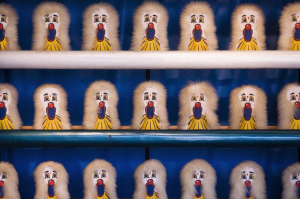 Amusement park shooting game targets on shelves