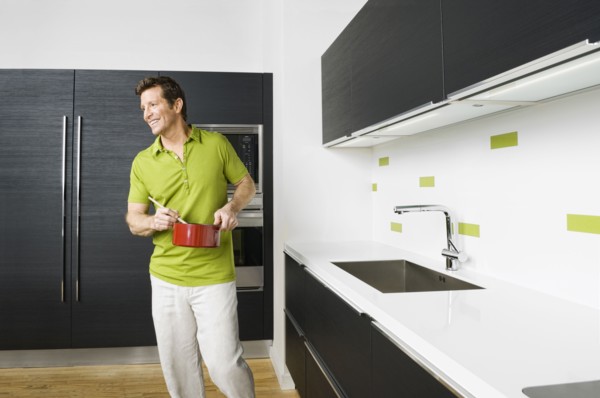 Caucasian man cooking in kitchen