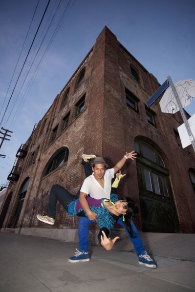 Couple breakdancing in urban area